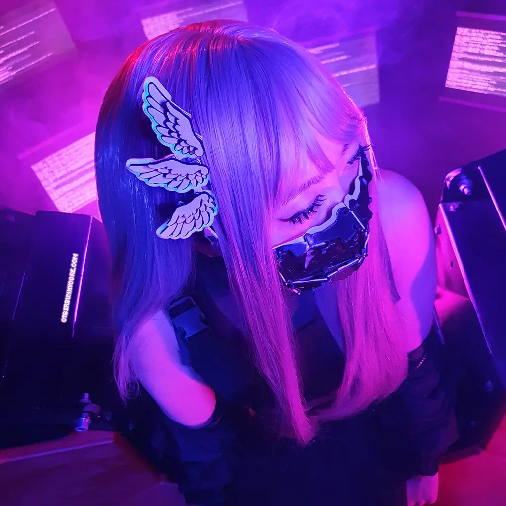 A person wearing a three winged glow in the dark Hair Clip